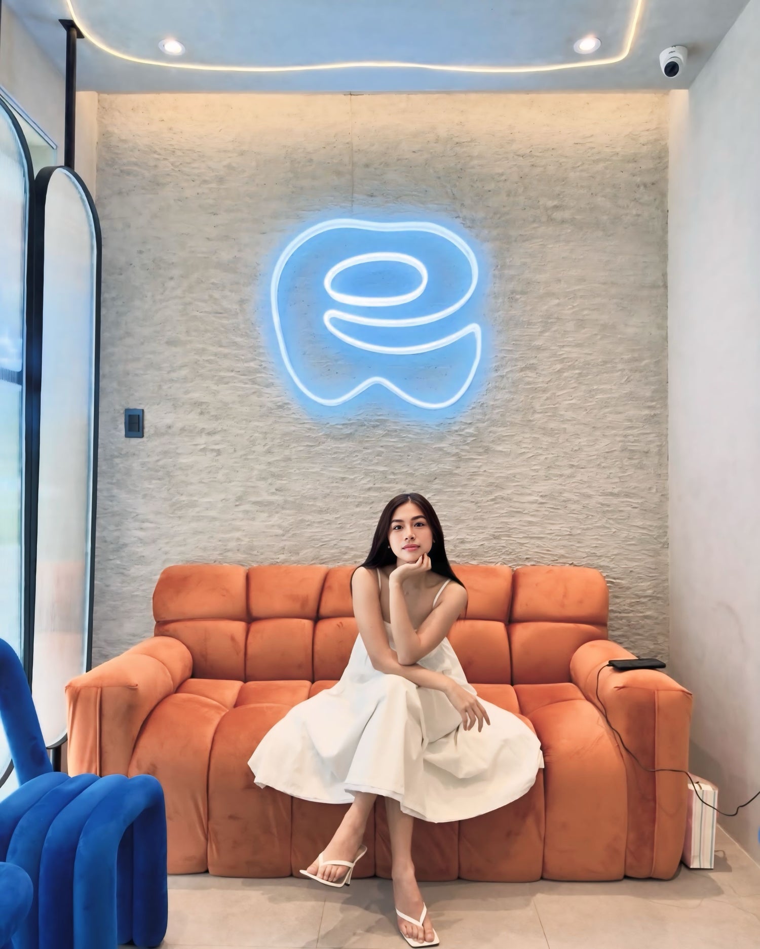 Satisfied dental patient posing in front of Quezon City clinic Easethetic Dental Lounge